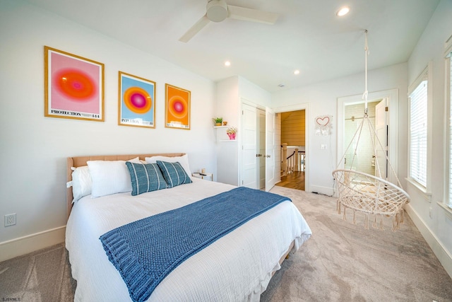 bedroom with light colored carpet and ceiling fan