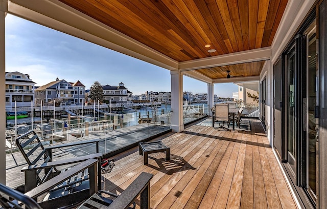 wooden terrace with a water view