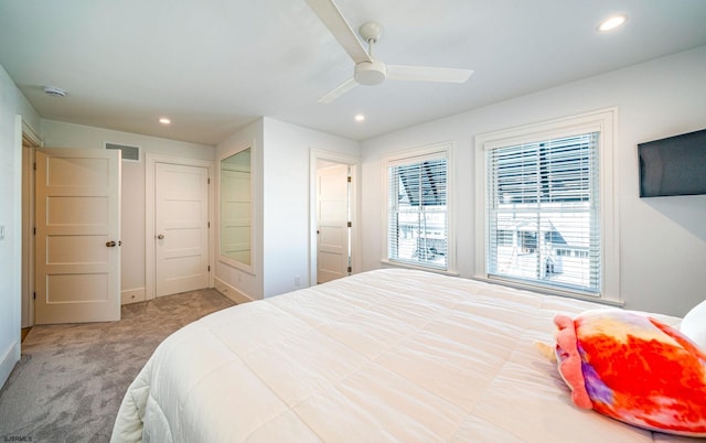 bedroom with ceiling fan and carpet floors