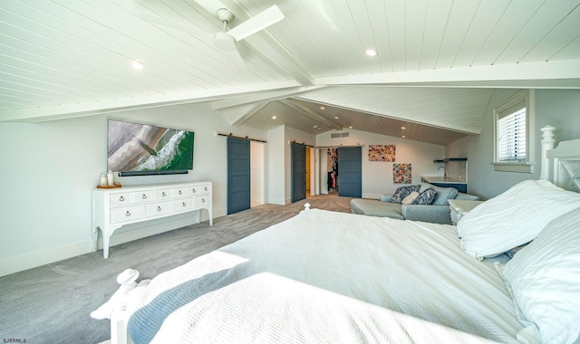 carpeted bedroom featuring wooden ceiling, a barn door, lofted ceiling with beams, and a spacious closet