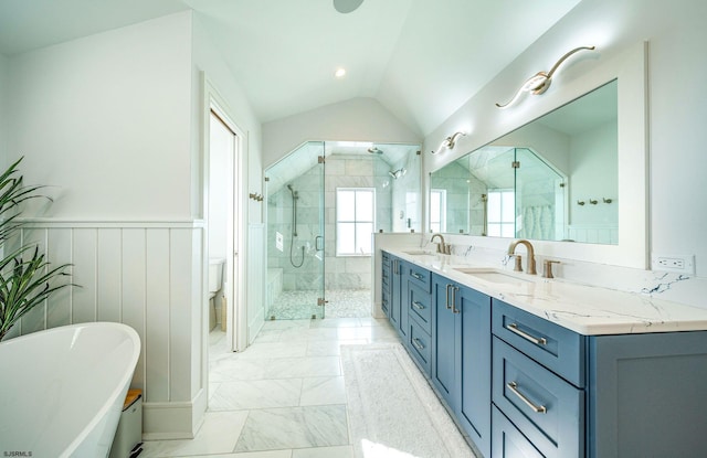 full bathroom with lofted ceiling, vanity, independent shower and bath, and toilet