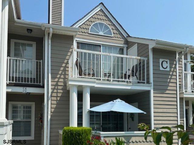 view of home's exterior featuring a balcony