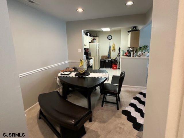 view of carpeted dining area