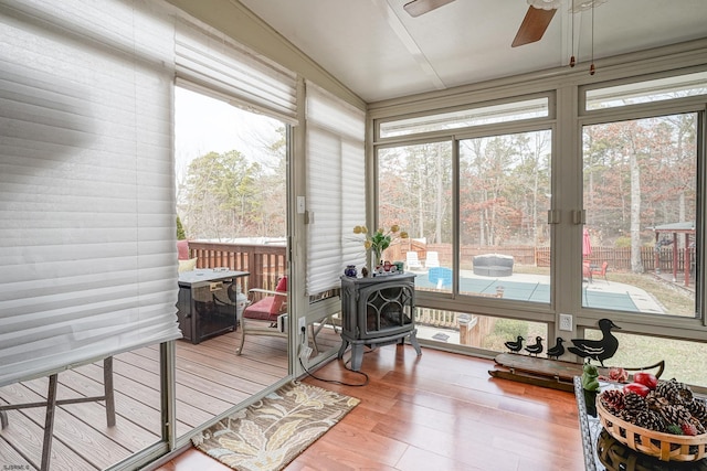 sunroom with a wealth of natural light and ceiling fan