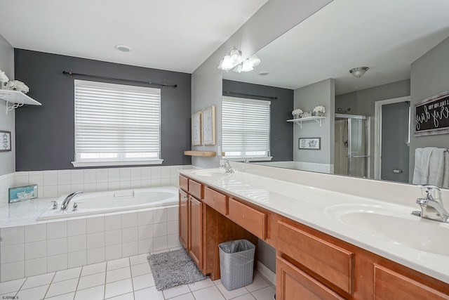 bathroom featuring vanity, separate shower and tub, and tile patterned floors