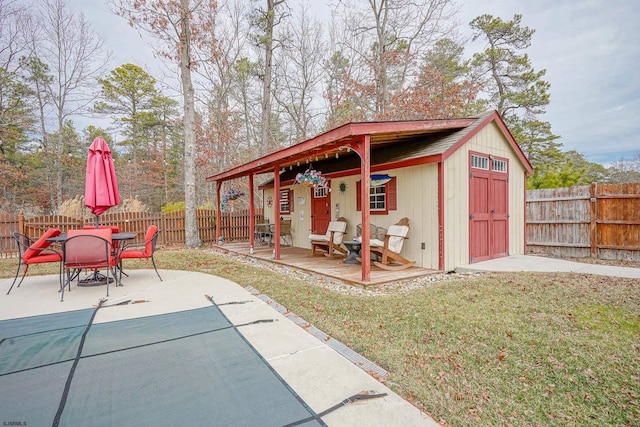 view of outbuilding featuring a lawn