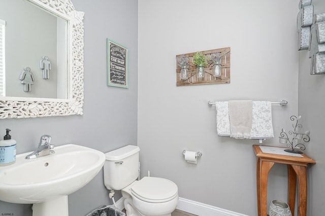 bathroom featuring sink and toilet