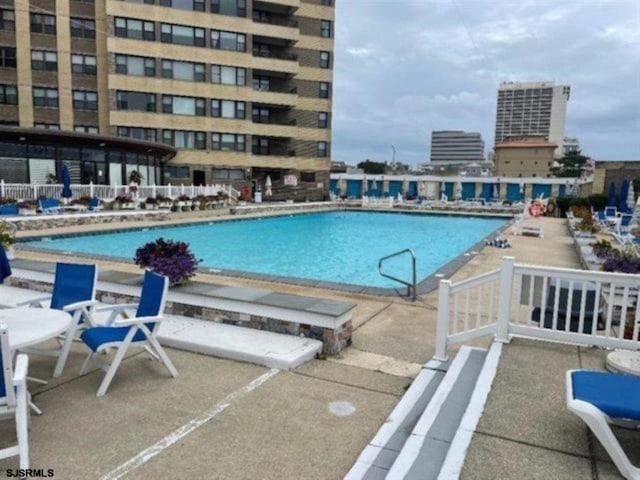 view of swimming pool featuring a patio area