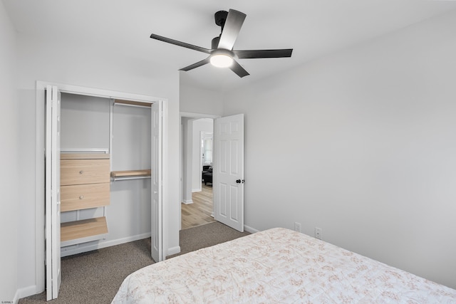 bedroom featuring ceiling fan, dark carpet, and a closet