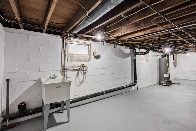 basement with water heater and sink