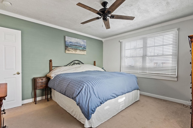 bedroom featuring crown molding, light carpet, and a textured ceiling