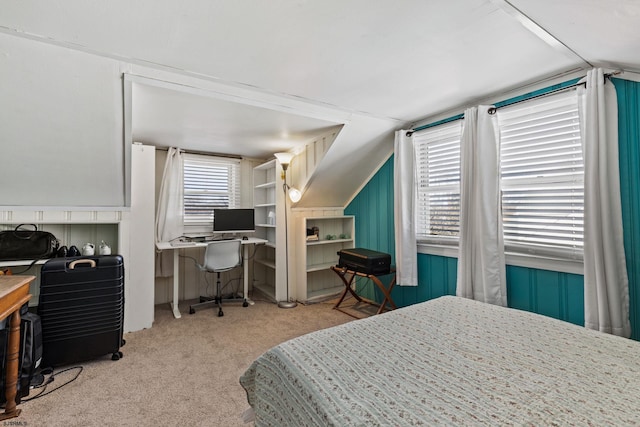 carpeted bedroom featuring lofted ceiling