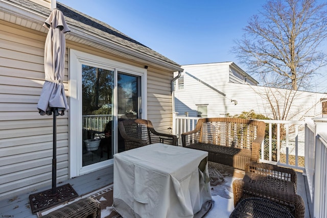 wooden terrace featuring grilling area