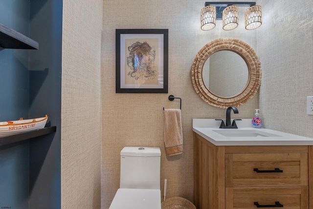 bathroom featuring vanity and toilet