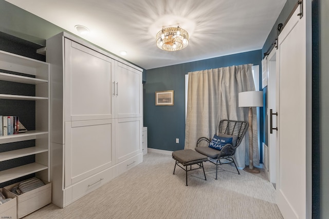 living area featuring an inviting chandelier, a barn door, and light carpet