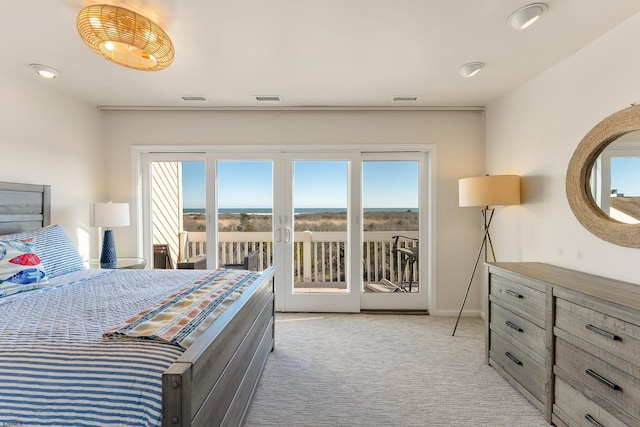 carpeted bedroom featuring access to exterior and french doors