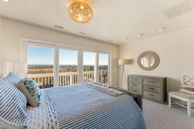 carpeted bedroom featuring access to outside