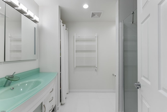 bathroom with vanity, radiator, and a shower