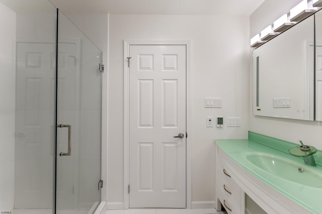 bathroom featuring an enclosed shower and vanity