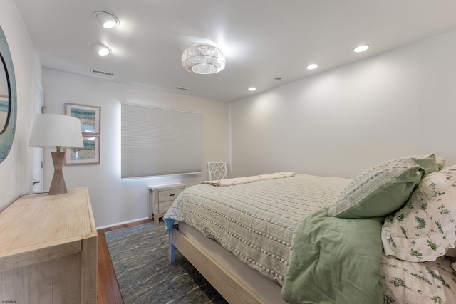 bedroom featuring dark hardwood / wood-style flooring