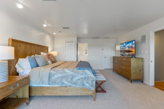 bedroom featuring light colored carpet