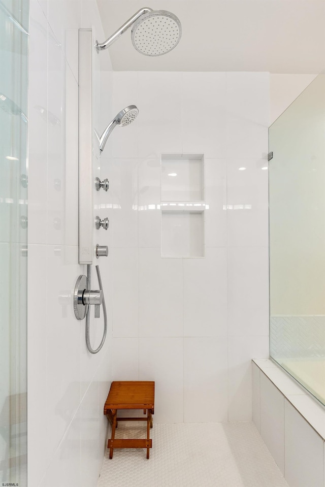 bathroom with a tile shower