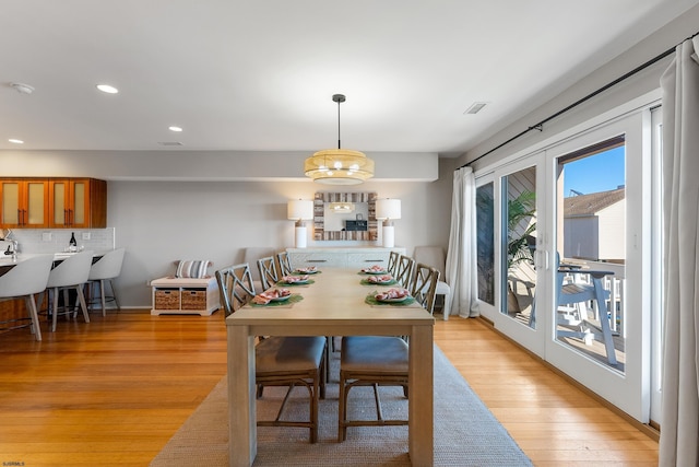 dining area with light hardwood / wood-style floors