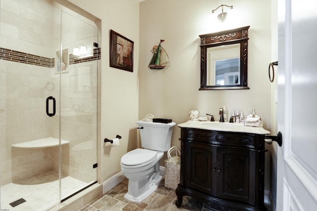 bathroom featuring vanity, toilet, and an enclosed shower