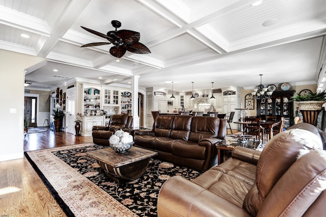 living room with crown molding, hardwood / wood-style flooring, coffered ceiling, and decorative columns