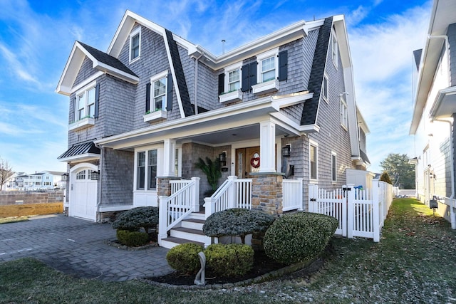 view of front of home featuring a garage and covered porch