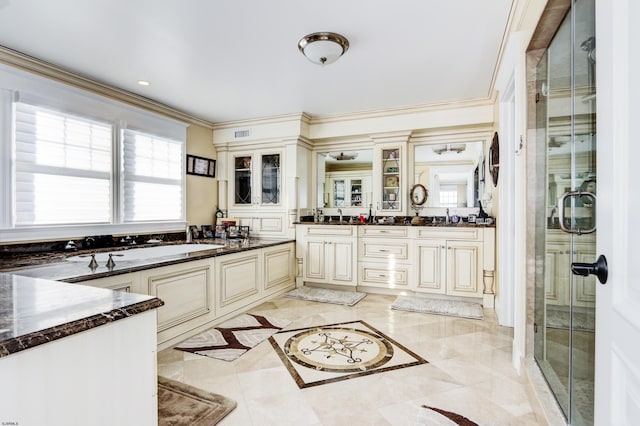 bathroom featuring independent shower and bath, crown molding, a wealth of natural light, and vanity