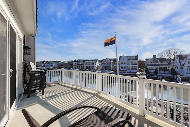 balcony with a deck with water view