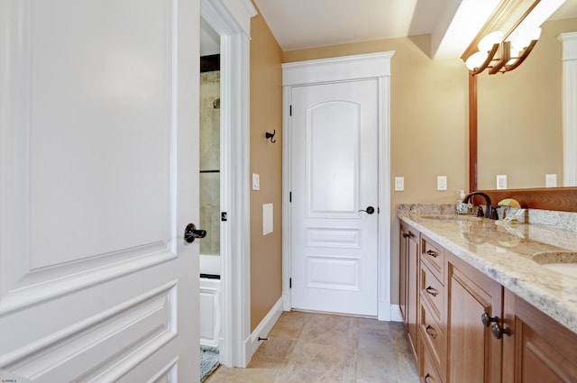 bathroom featuring vanity and a chandelier