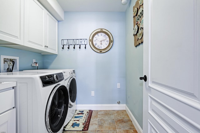 laundry room with cabinets and washer and dryer