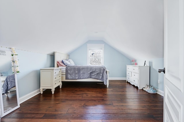 bedroom with lofted ceiling and dark wood-type flooring