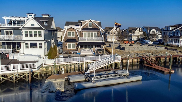 back of property with a water view