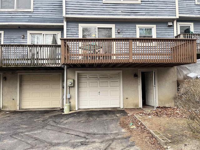 back of house with a garage