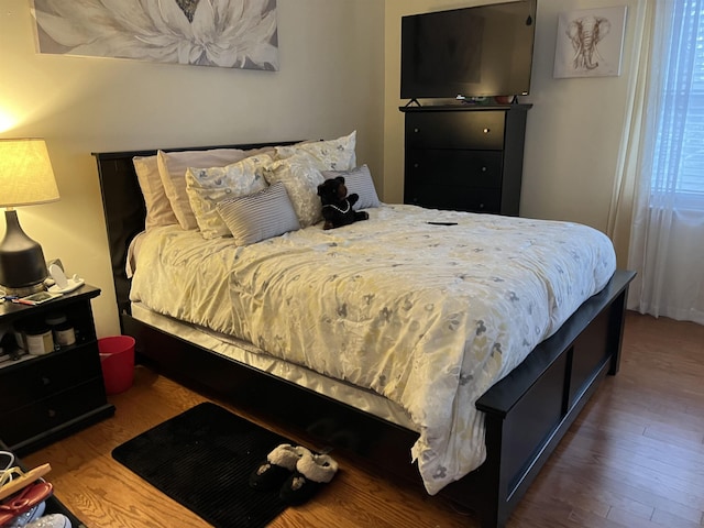 bedroom with wood-type flooring