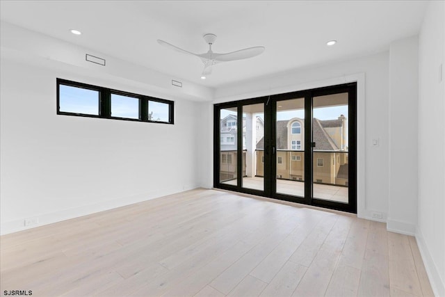 unfurnished room with light hardwood / wood-style flooring and ceiling fan