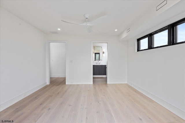 spare room with light hardwood / wood-style floors and ceiling fan