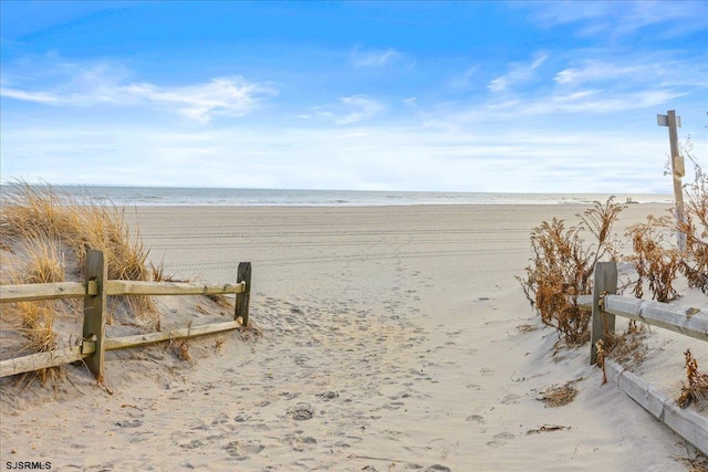 view of water feature with a beach view