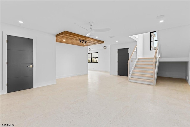 interior space featuring ceiling fan