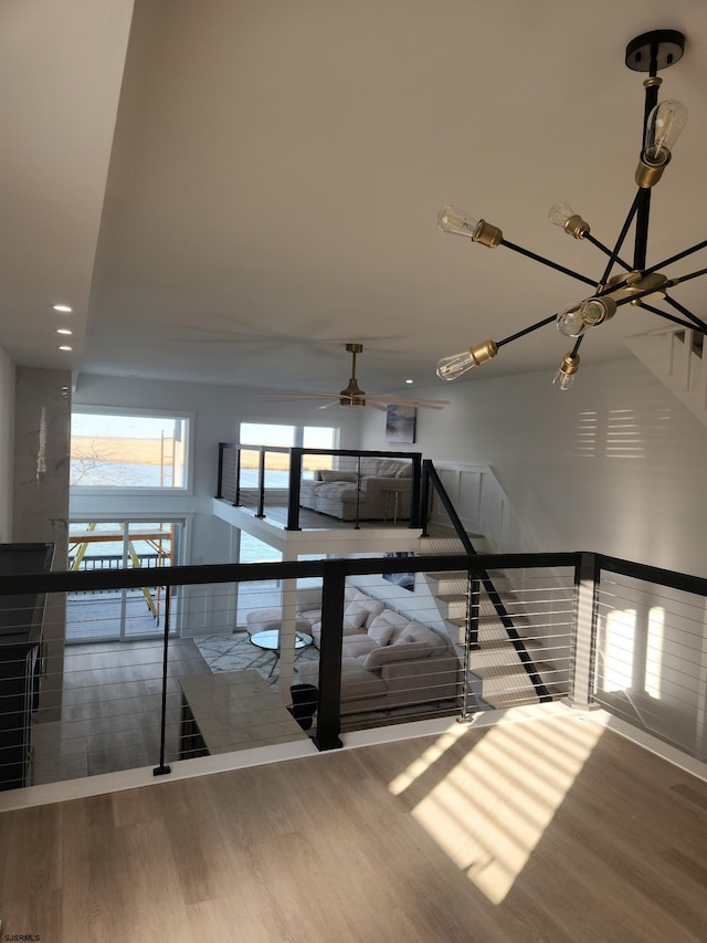 stairs featuring hardwood / wood-style flooring