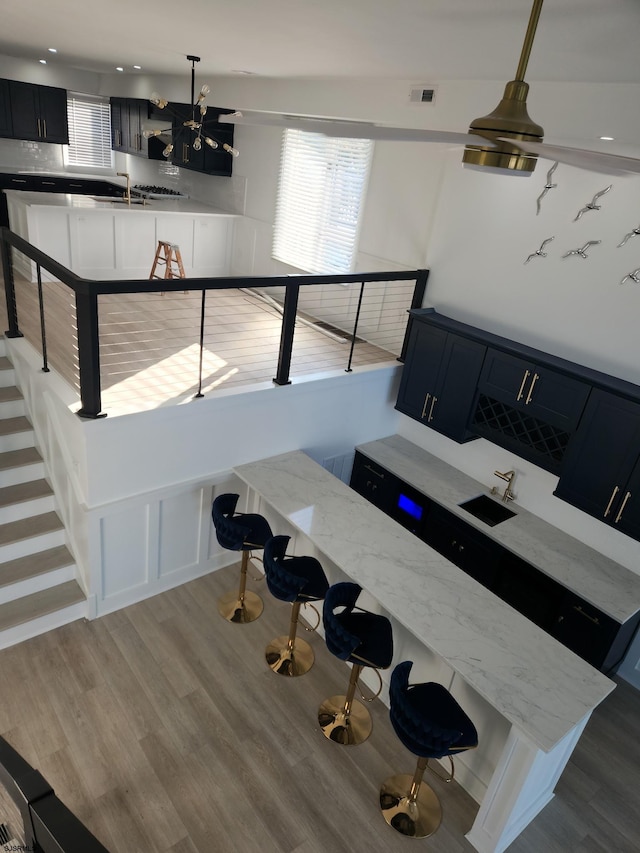 dining space featuring sink and hardwood / wood-style floors