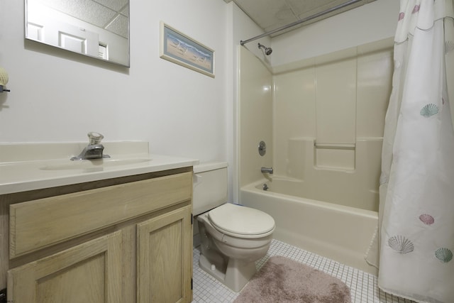 full bathroom featuring tile patterned flooring, vanity, toilet, and shower / bath combo with shower curtain