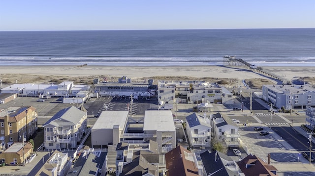 aerial view featuring a water view and a beach view