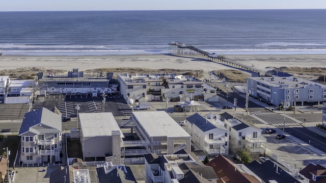 aerial view featuring a water view and a beach view