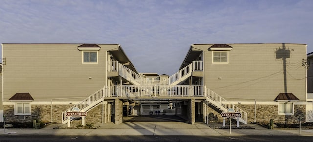 rear view of house featuring a carport