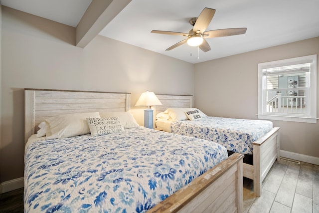 bedroom with ceiling fan and light hardwood / wood-style floors