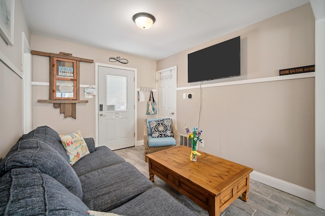 living room with light hardwood / wood-style flooring